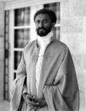 Haile Selassie I (Ge'ez: 'Power of the Trinity', 23 July 1892 – 27 August 1975), born Tafari Makonnen, was Ethiopia's regent from 1916 to 1930 and Emperor of Ethiopia from 1930 to 1974. The heir to a dynasty that traced its origins to the 13th century, and from there by tradition back to King Solomon and the Queen of Sheba, Haile Selassie is a defining figure in both Ethiopian and African history.<br/><br/>

At the League of Nations in 1936, the Emperor condemned the use of chemical weapons by Italy against his people. His internationalist views led to Ethiopia becoming a charter member of the United Nations, and his political thought and experience in promoting multilateralism and collective security have proved seminal and enduring. His suppression of rebellions among the nobles, as well as what some perceived to be Ethiopia's failure to modernize adequately, earned him criticism among some contemporaries and historians.<br/><br/>

Haile Selassie is revered as the returned Messiah of the Bible, God incarnate, among the Rastafari movement, the number of followers of which is estimated between 200,000 and 800,000. Begun in Jamaica in the 1930s, the Rastafari movement perceives Haile Selassie as a messianic figure who will lead a future golden age of eternal peace, righteousness, and prosperity. He himself remained an Ethiopian Orthodox Christian throughout his life.