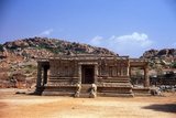 The Vittala Temple, built in the early 16th century, is devoted to the Hindu god Vithoba (also known as Vitthala and Panduranga), an incarnation of Vishnu or his avatar Krishna.<br/><br/>

Hampi is a village in northern Karnataka state. It is located within the ruins of Vijayanagara, the former capital of the Vijayanagara Empire. Predating the city of Vijayanagara, it continues to be an important religious centre, housing the Virupaksha Temple, as well as several other monuments belonging to the old city.