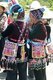 China: Bai women with their colourful shoulder bags, Bai music and dance festival, Santa Si (Three Pagodas), Dali, Yunnan