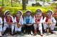 China: Bai women wear their 3D glasses at the Bai music and dance festival at  Santa Si (Three Pagodas), the symbol of Dali, Dali, Yunnan